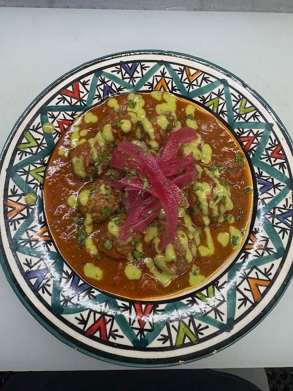 Moroccan Meatballs with herb tomato sauce and pickled red onion